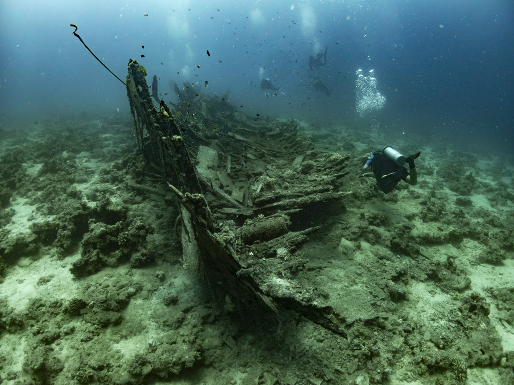 some divers around a wreck